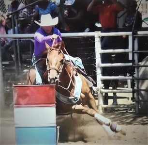 Natasha Zunck racing on a barrel performance horse